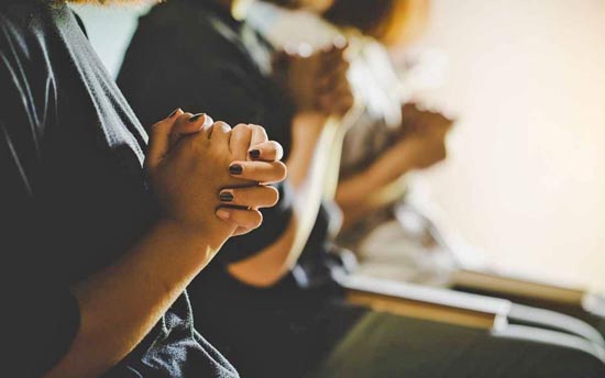 Praying during the Watch Night service.