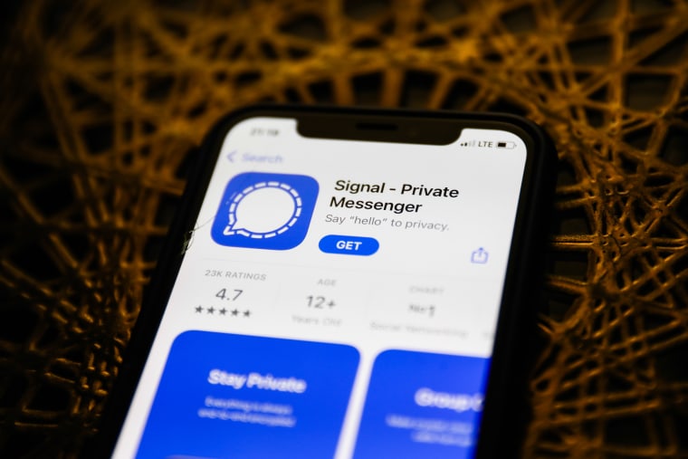 Signal logo on the App Store is seen displayed on a phone screen